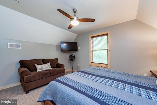 bedroom with vaulted ceiling, light colored carpet, and ceiling fan