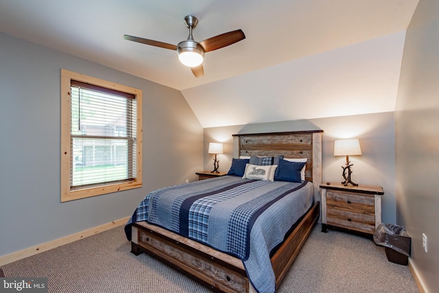 carpeted bedroom featuring vaulted ceiling and ceiling fan