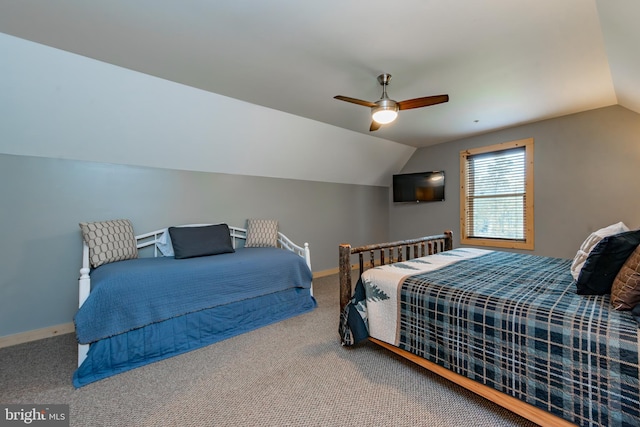 bedroom featuring ceiling fan, carpet flooring, and lofted ceiling