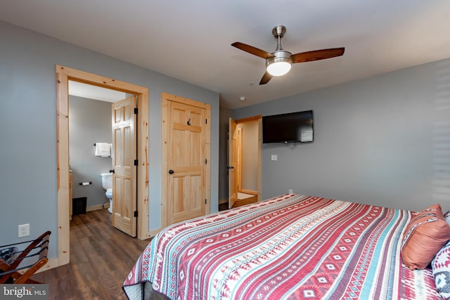 bedroom featuring dark hardwood / wood-style floors, ensuite bath, and ceiling fan