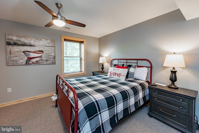 bedroom featuring dark colored carpet and ceiling fan