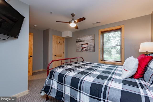 bedroom with ceiling fan and carpet flooring