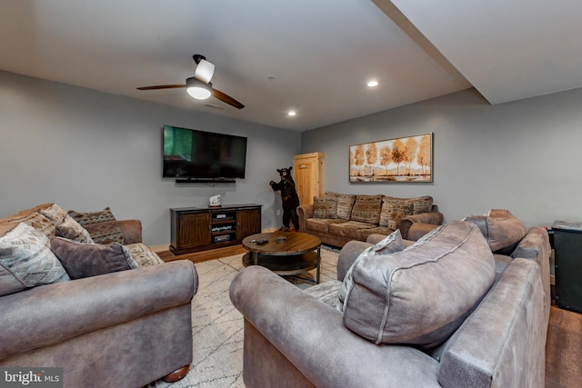 living room featuring light wood-type flooring and ceiling fan