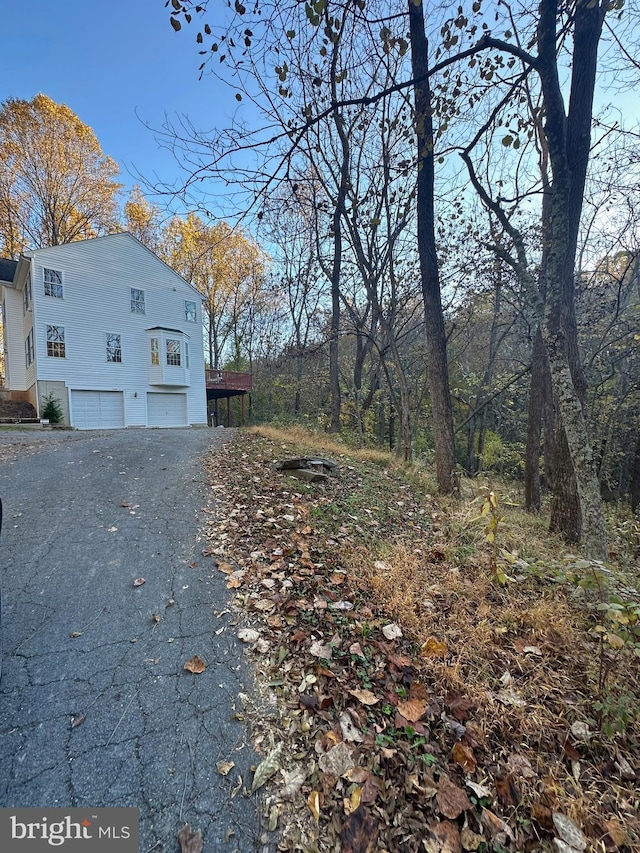 view of side of property with a garage