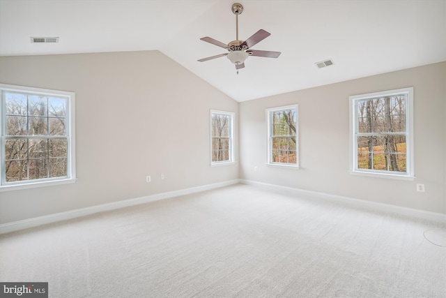 empty room with carpet, ceiling fan, and lofted ceiling