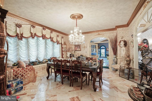 dining room featuring crown molding, a textured ceiling, and a chandelier