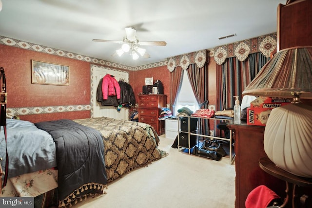 carpeted bedroom featuring ceiling fan