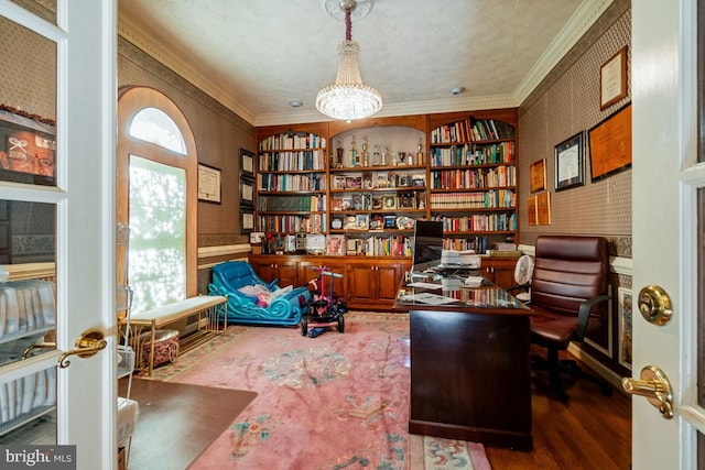 sitting room featuring a notable chandelier, ornamental molding, and dark hardwood / wood-style flooring