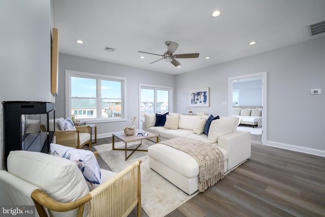 bedroom with ceiling fan and dark hardwood / wood-style flooring