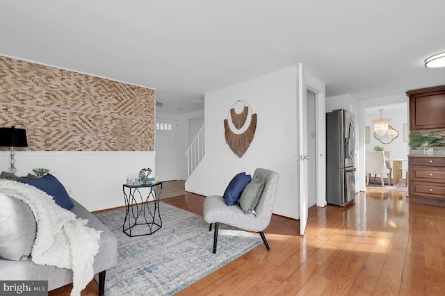 sitting room featuring hardwood / wood-style floors