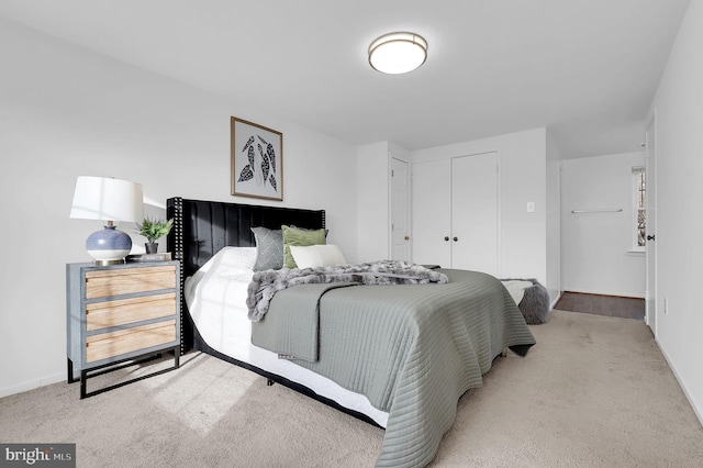 bedroom with light colored carpet