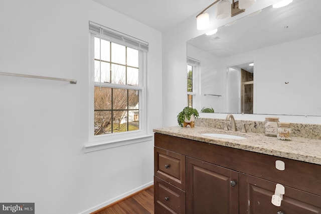 bathroom featuring vanity and hardwood / wood-style flooring