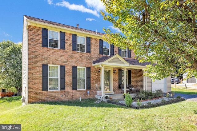 view of front facade with a front lawn and a garage