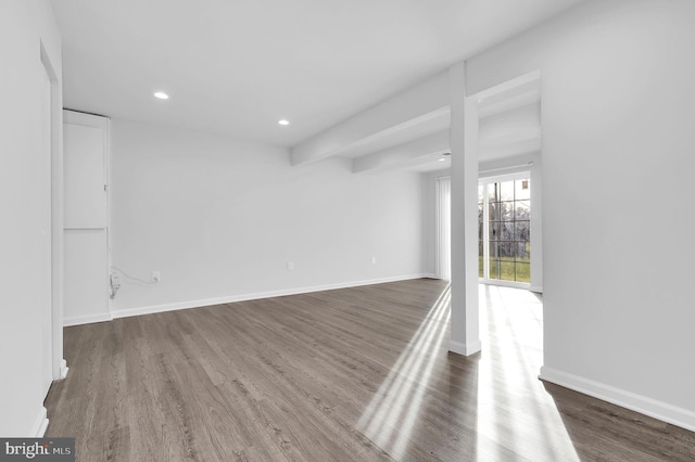 spare room with dark hardwood / wood-style floors