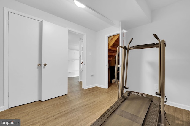 workout area featuring light wood-type flooring