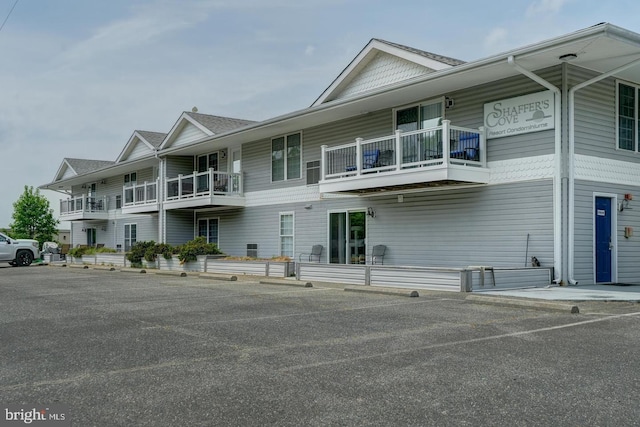 view of front of house with a balcony