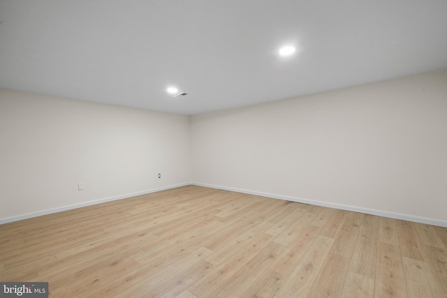 unfurnished room with light hardwood / wood-style floors