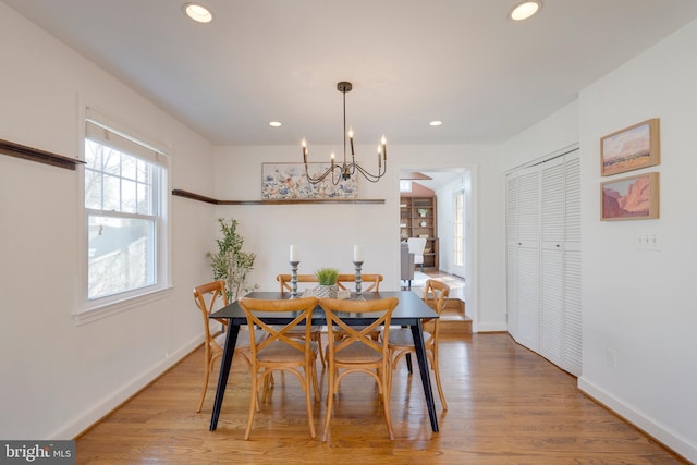 dining space with baseboards, a chandelier, wood finished floors, and recessed lighting