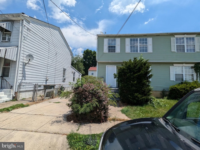 view of side of home featuring cooling unit