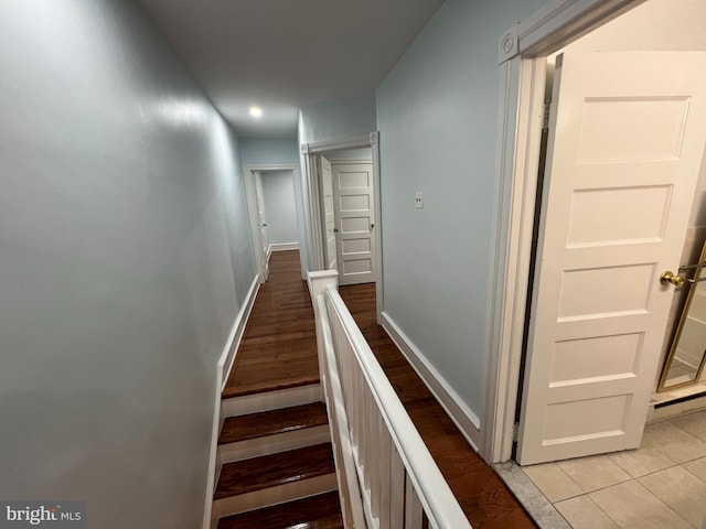 stairway featuring hardwood / wood-style flooring