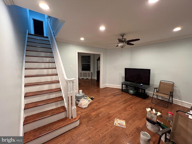 living room featuring hardwood / wood-style flooring and ceiling fan