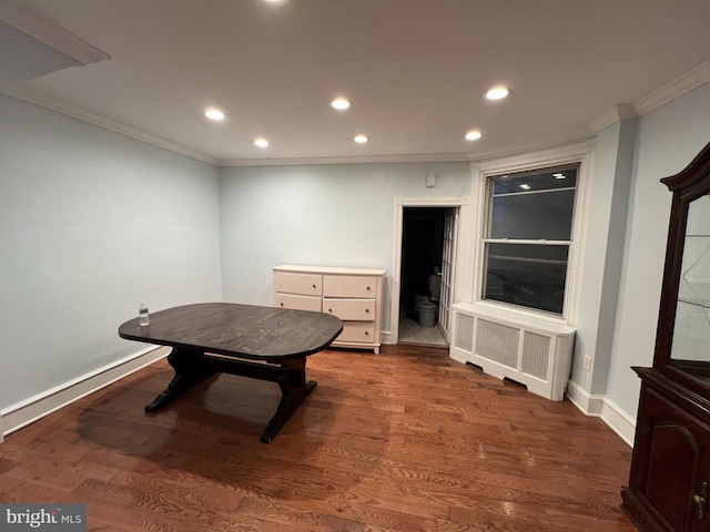 rec room featuring crown molding, radiator heating unit, and dark hardwood / wood-style floors