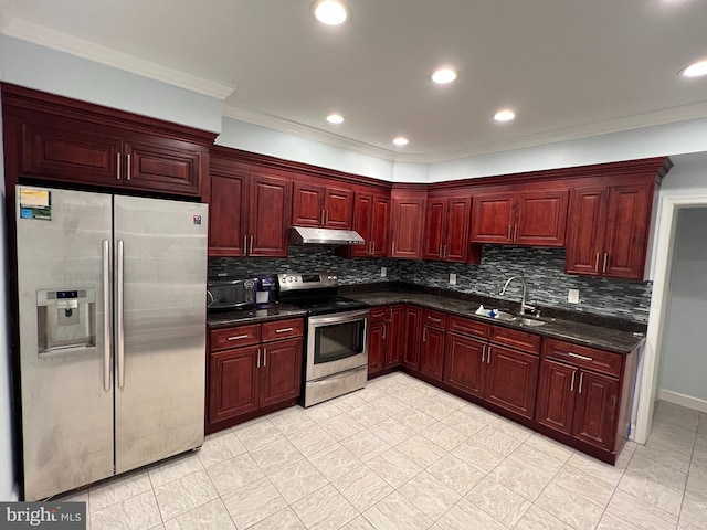 kitchen with backsplash, appliances with stainless steel finishes, dark stone countertops, crown molding, and sink