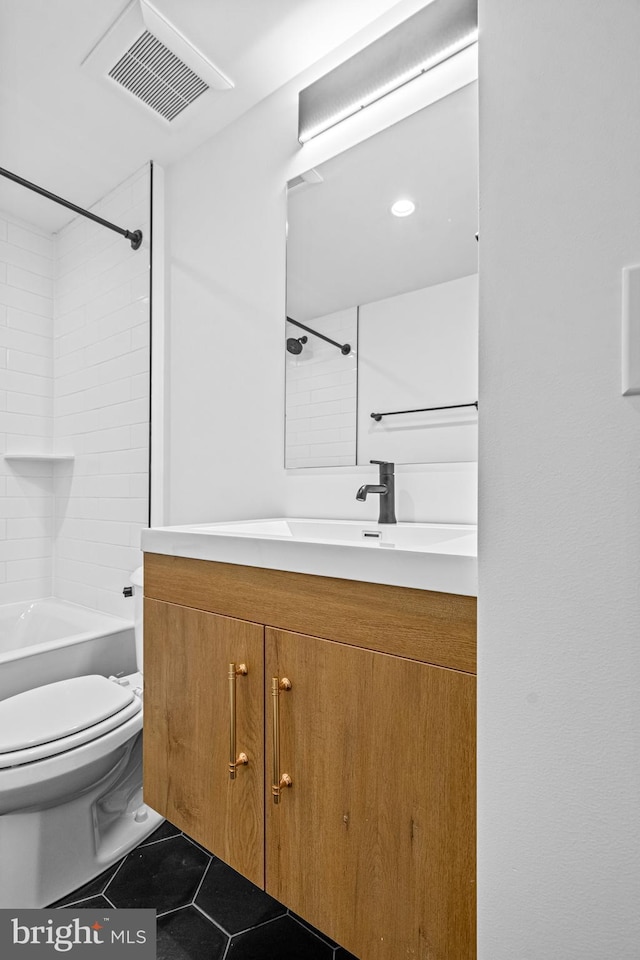 full bathroom featuring visible vents, toilet, tile patterned floors, vanity, and shower / washtub combination