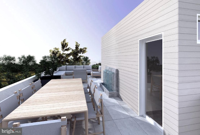 view of patio with outdoor dining area and an outdoor living space