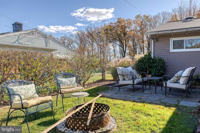 view of yard featuring a fire pit and a patio area