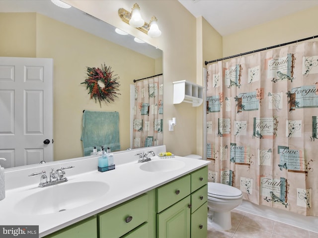 bathroom featuring toilet, vanity, tile patterned floors, and walk in shower