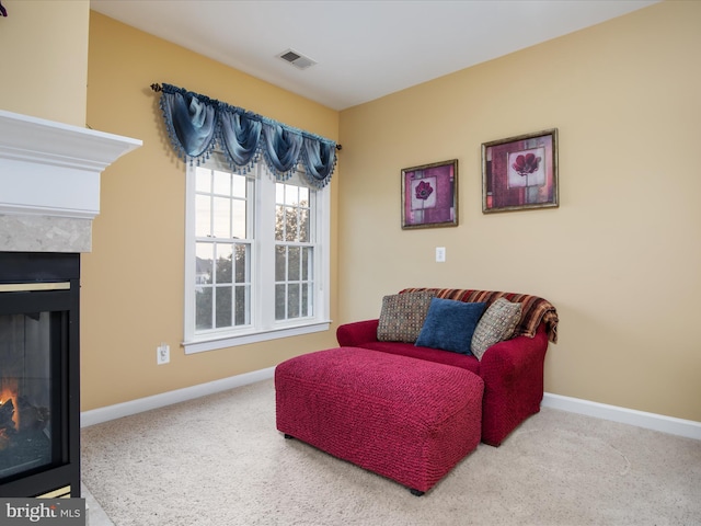 sitting room with carpet floors