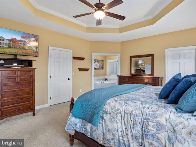 carpeted bedroom with crown molding, ceiling fan, and a raised ceiling