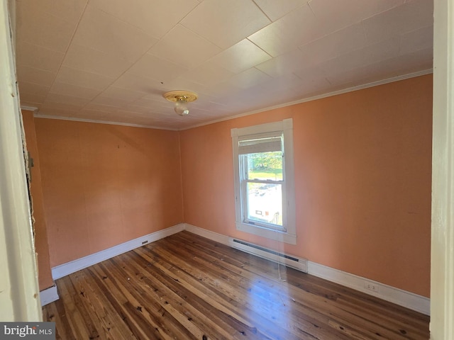 unfurnished room with wood-type flooring, ornamental molding, and baseboard heating