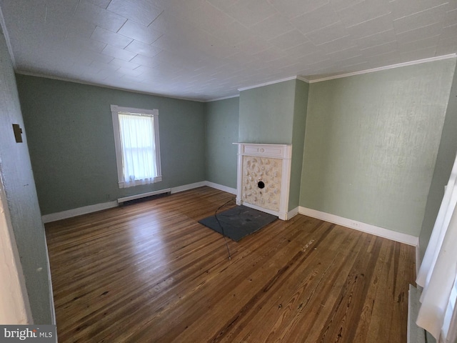 unfurnished living room with a baseboard radiator, dark wood-type flooring, and ornamental molding