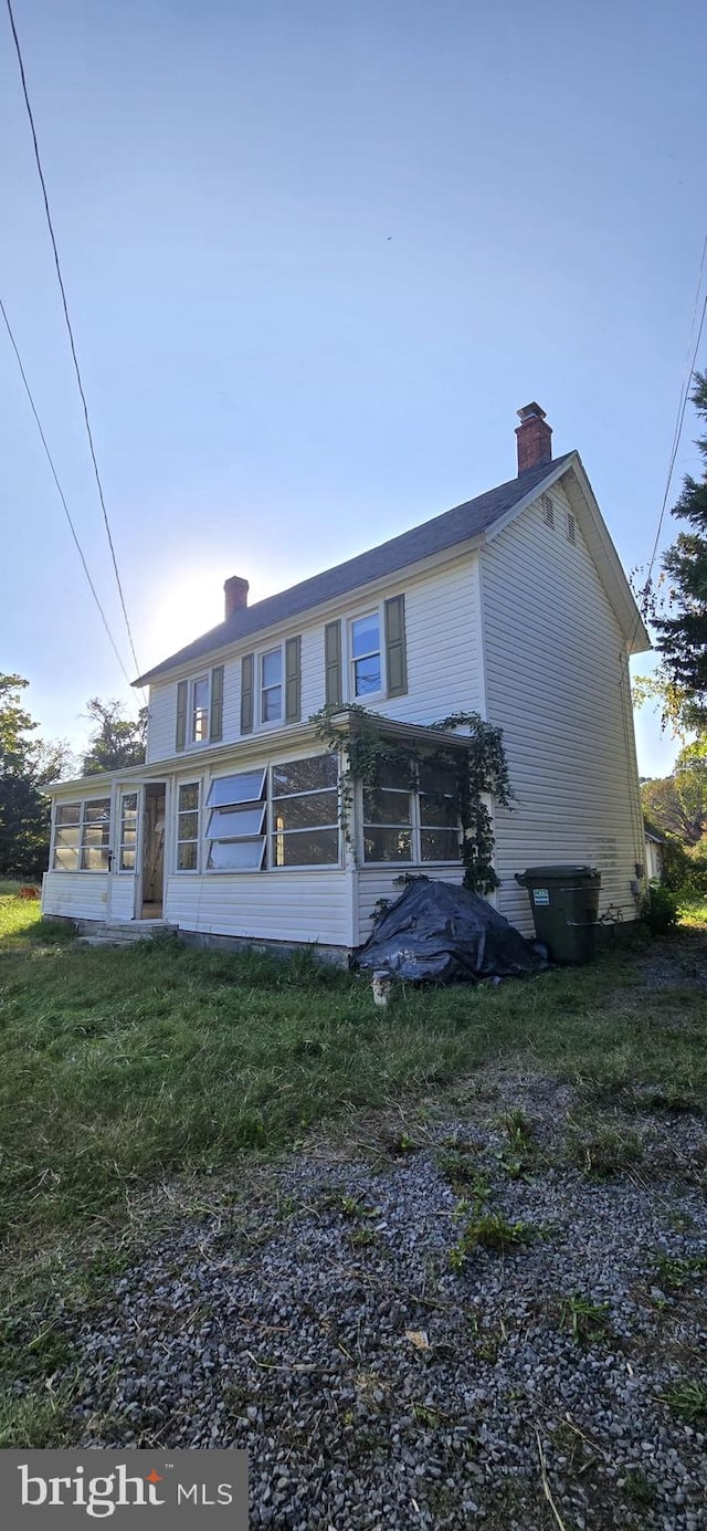 view of front facade featuring a sunroom