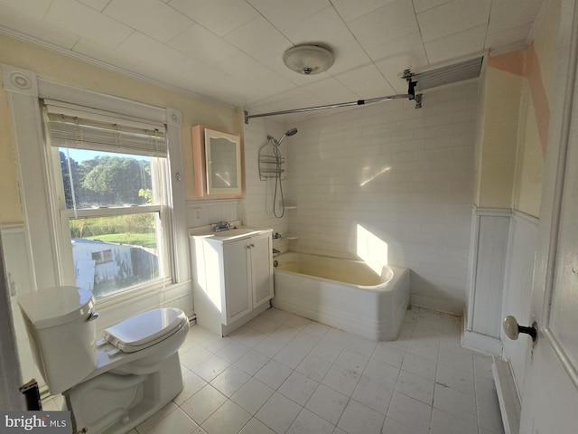 full bathroom with vanity, tiled shower / bath combo, toilet, and tile patterned flooring