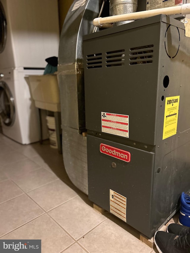 utility room featuring heating unit