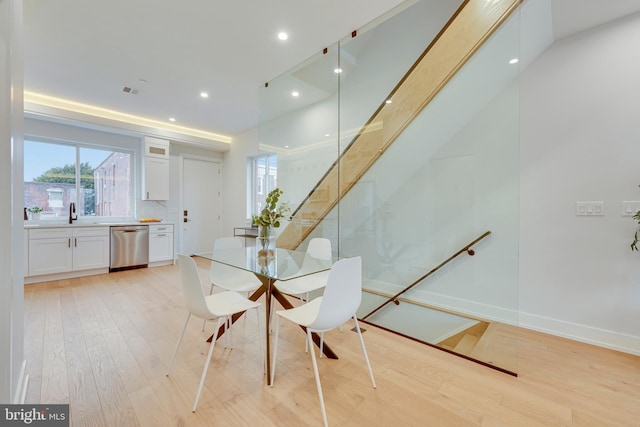 3011 Gaul St, Philadelphia, PA 19134 - dining area featuring light wood finished floors, recessed lighting, baseboards, and stairs
