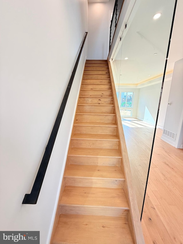 3011 Gaul St, Philadelphia, PA 19134 - stairs with wood finished floors and recessed lighting