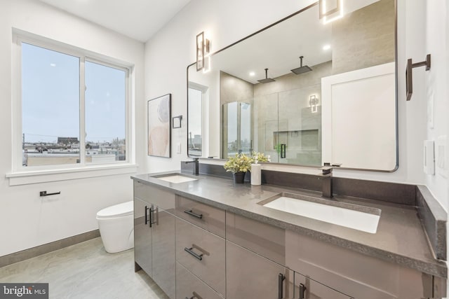 3011 Gaul St, Philadelphia, PA 19134 - bathroom with a shower stall, double vanity, baseboards, and toilet