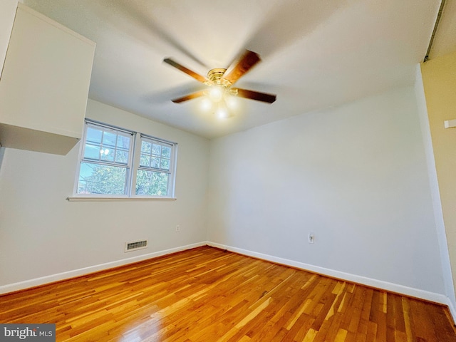 unfurnished room featuring ceiling fan and light hardwood / wood-style flooring