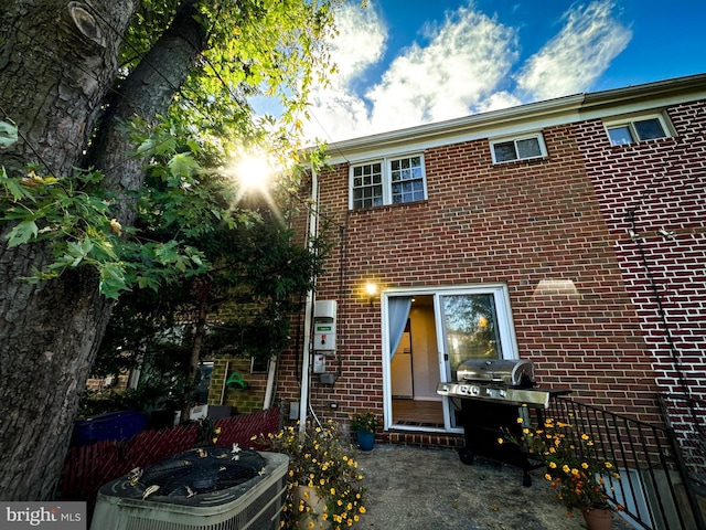 back of property featuring central AC unit