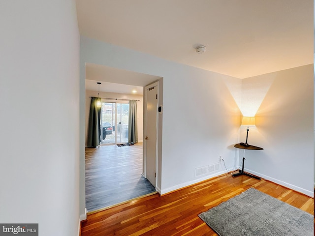 empty room featuring wood-type flooring