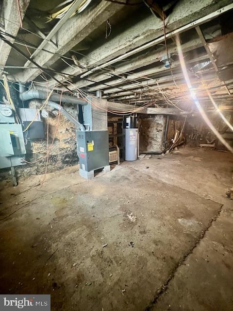 basement with gas water heater and heating unit