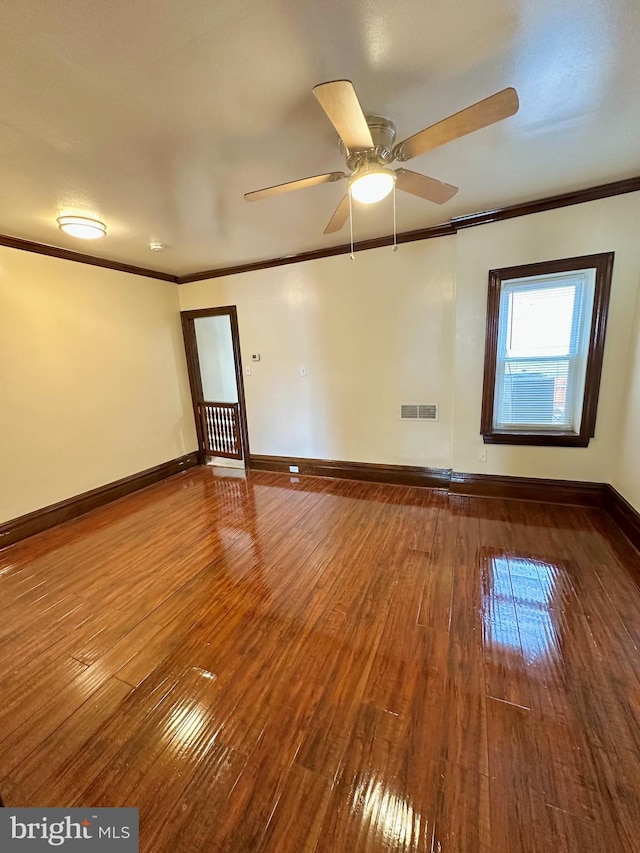 unfurnished room featuring ornamental molding, hardwood / wood-style floors, and ceiling fan