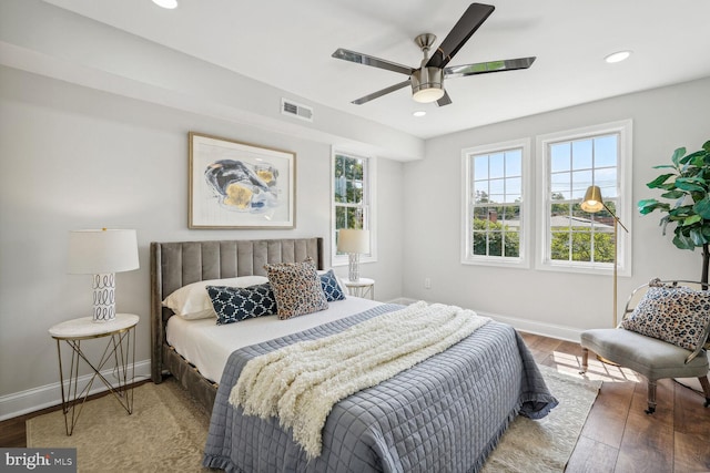 bedroom with wood-type flooring and ceiling fan