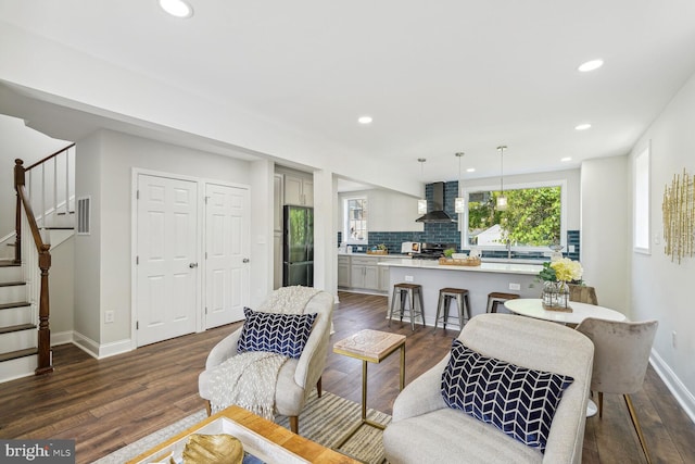 living room featuring dark wood-type flooring