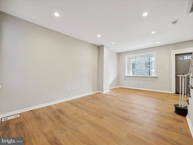 unfurnished living room featuring light wood-type flooring