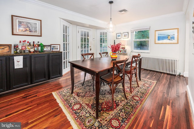 dining space featuring ornamental molding, french doors, dark hardwood / wood-style floors, and radiator